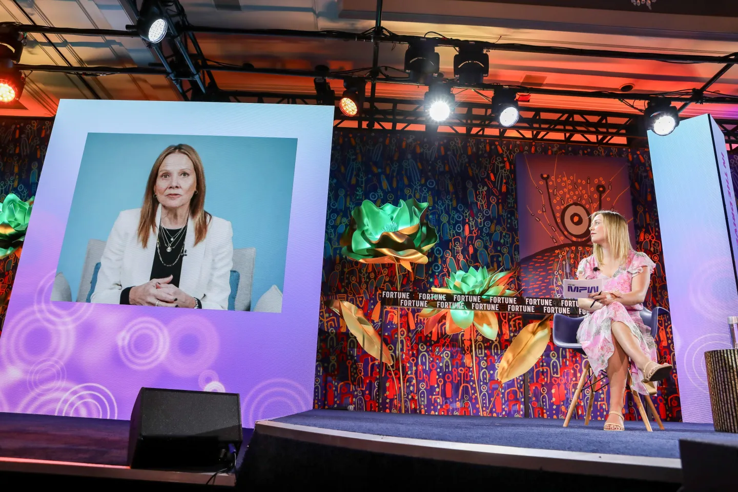 two women seated onstage in conversation