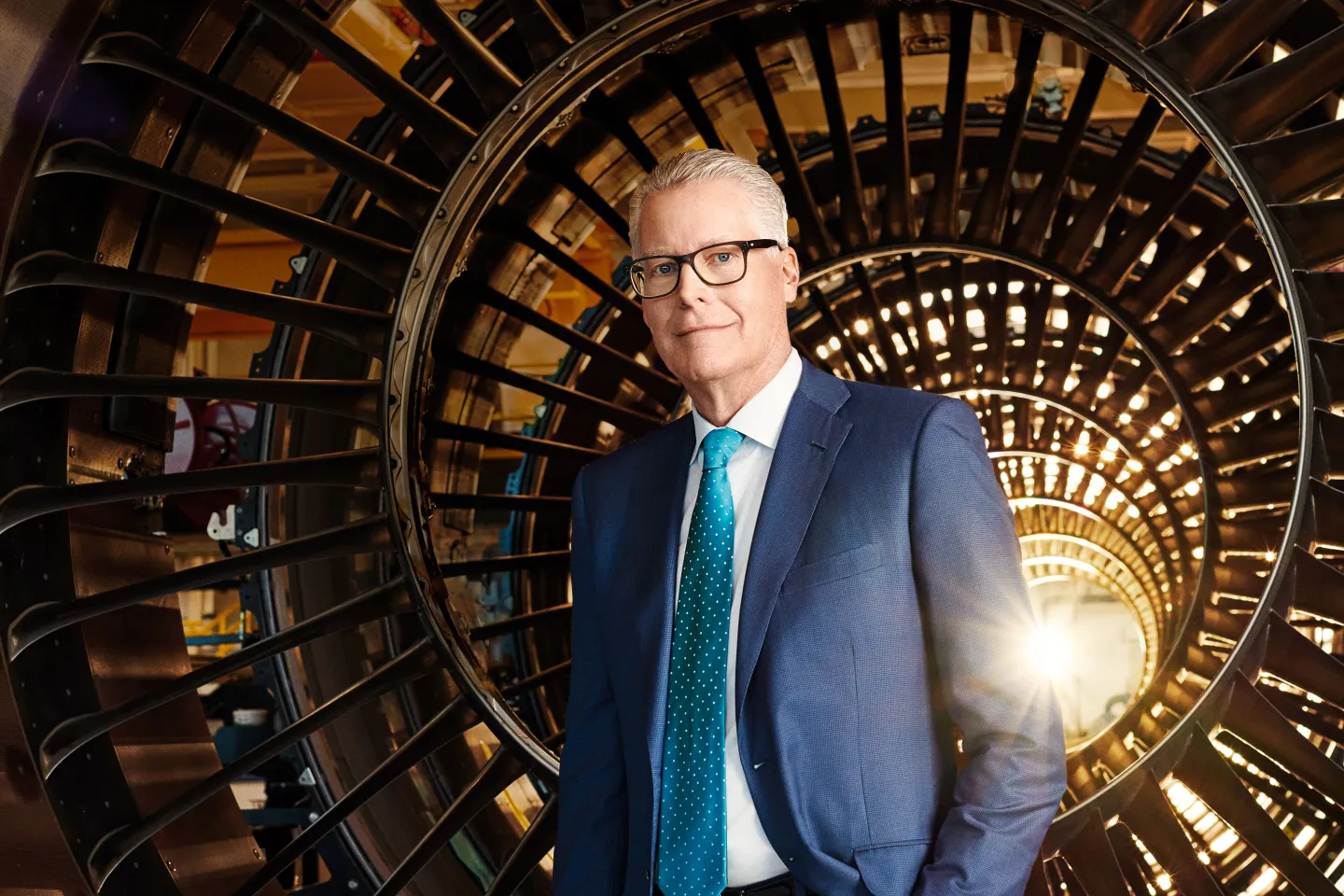Bastian poses with a Rolls-Royce Trent 7000 and 1000 engine casings at Delta’s headquarters in Atlanta.
