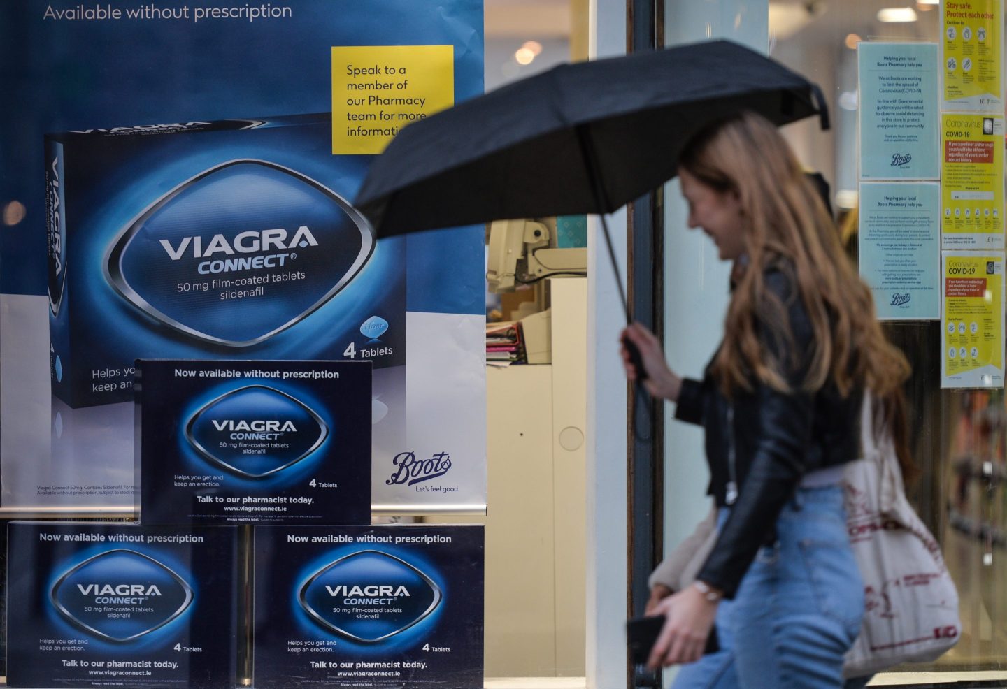 People walking by Viagra Connect ad seen in The Boots Pharmacy window in Dublin during Level 5 Covid-19 lockdown. On Thursday, 28 January, 2021, in Dublin, Ireland.