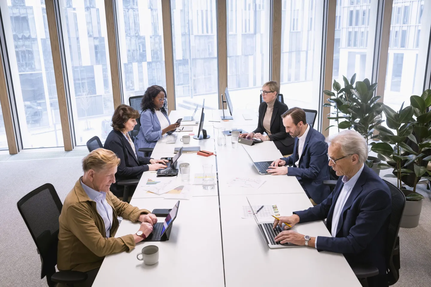 Multiracial corporate colleagues working in office