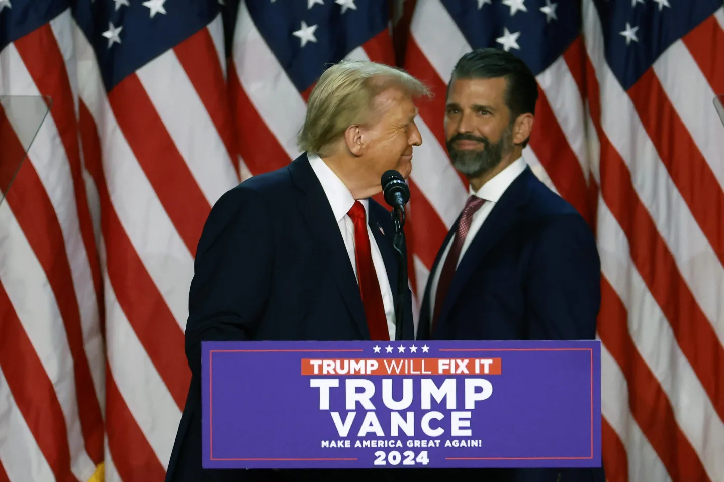 Republican presidential nominee, former U.S. President Donald Trump arrives to speak with Donald Trump Jr. during an election night event at the Palm Beach Convention Center on November 06, 2024
