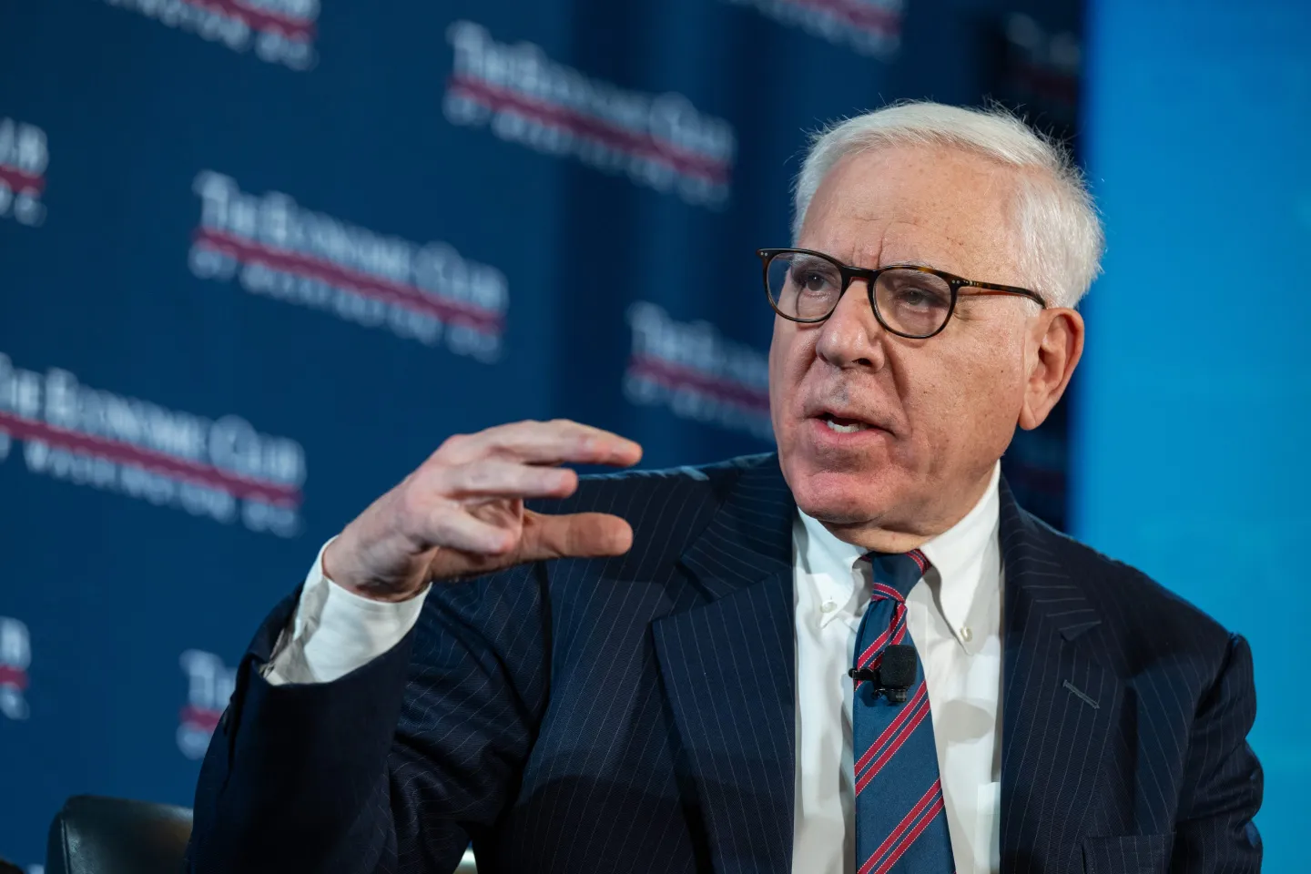 David Rubenstein gestures