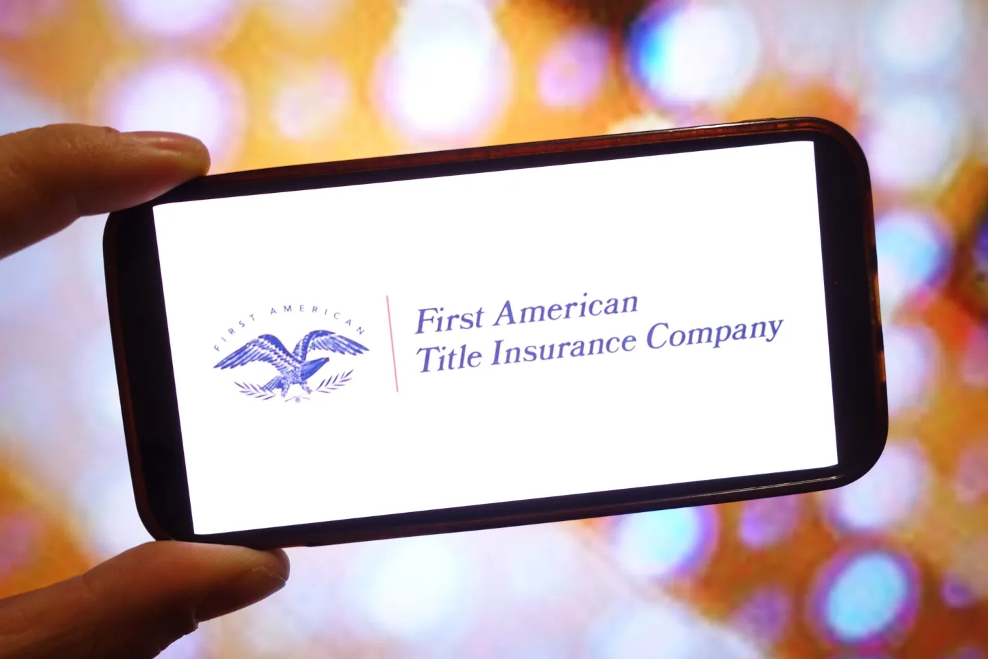In this photo illustration, the First American Financial Corporation company logo is seen displayed on a smartphone screen.