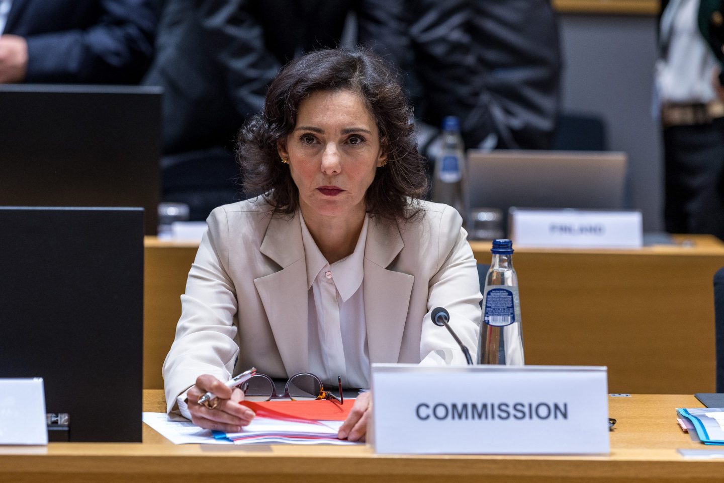 The EU's Preparedness and Crisis Management Commissioner Hadja Lahbib sits at a table and speaks into a microphone