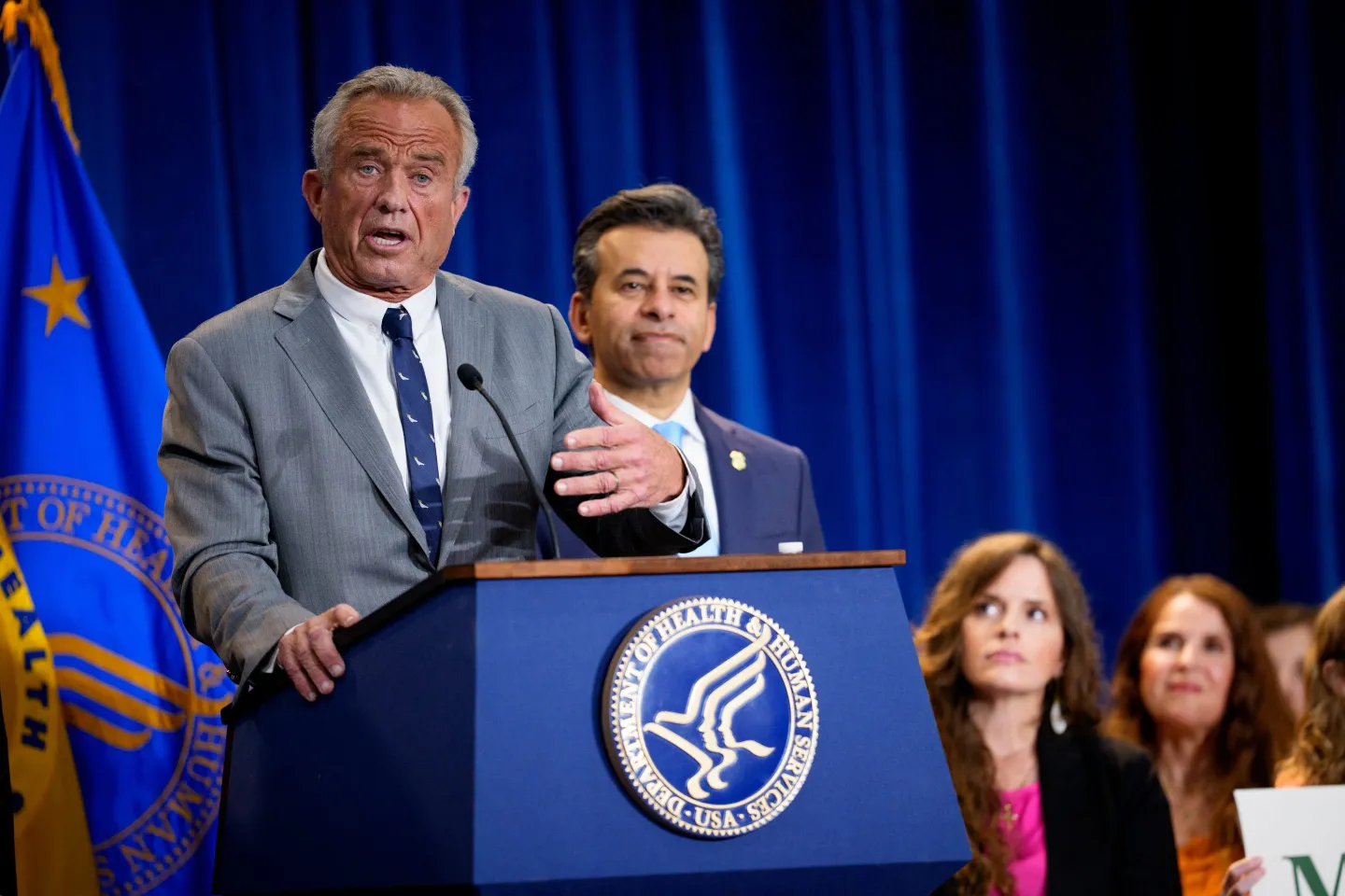 RFK Jr. at a press conference lectern
