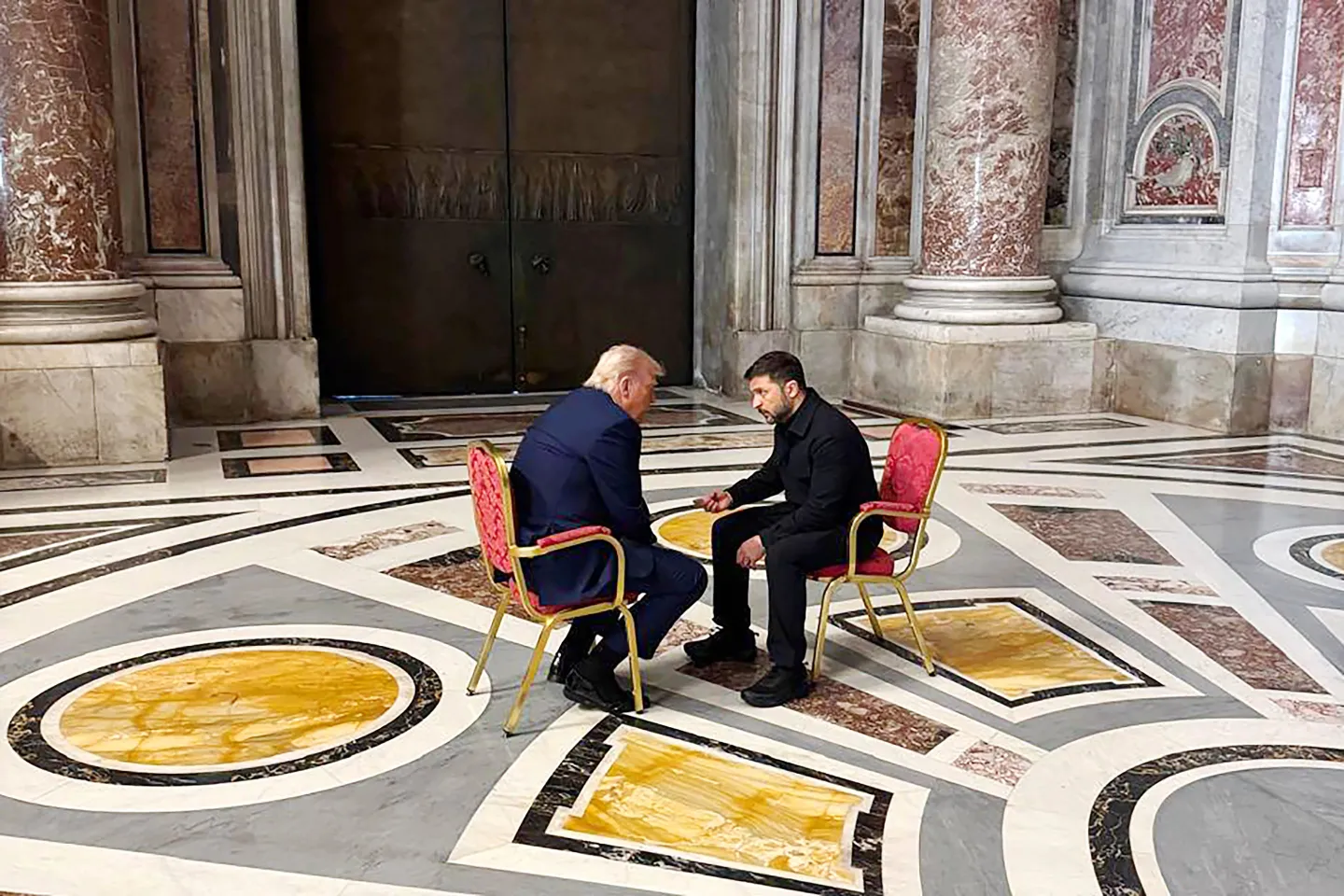 Trump and Zelensky sit in chairs face to face during Pope Francis' funeral