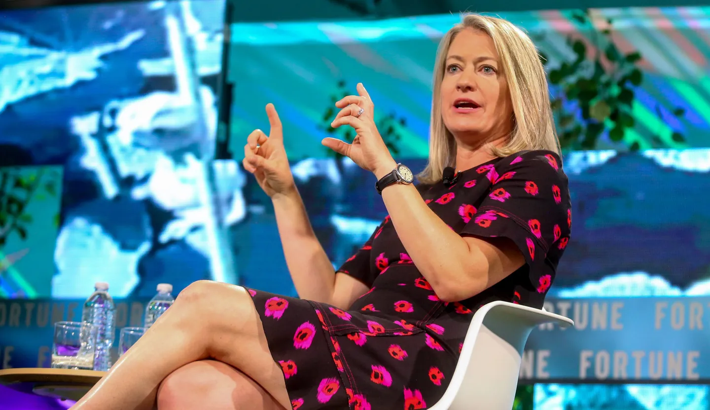 Jamie Miller speaking onstage