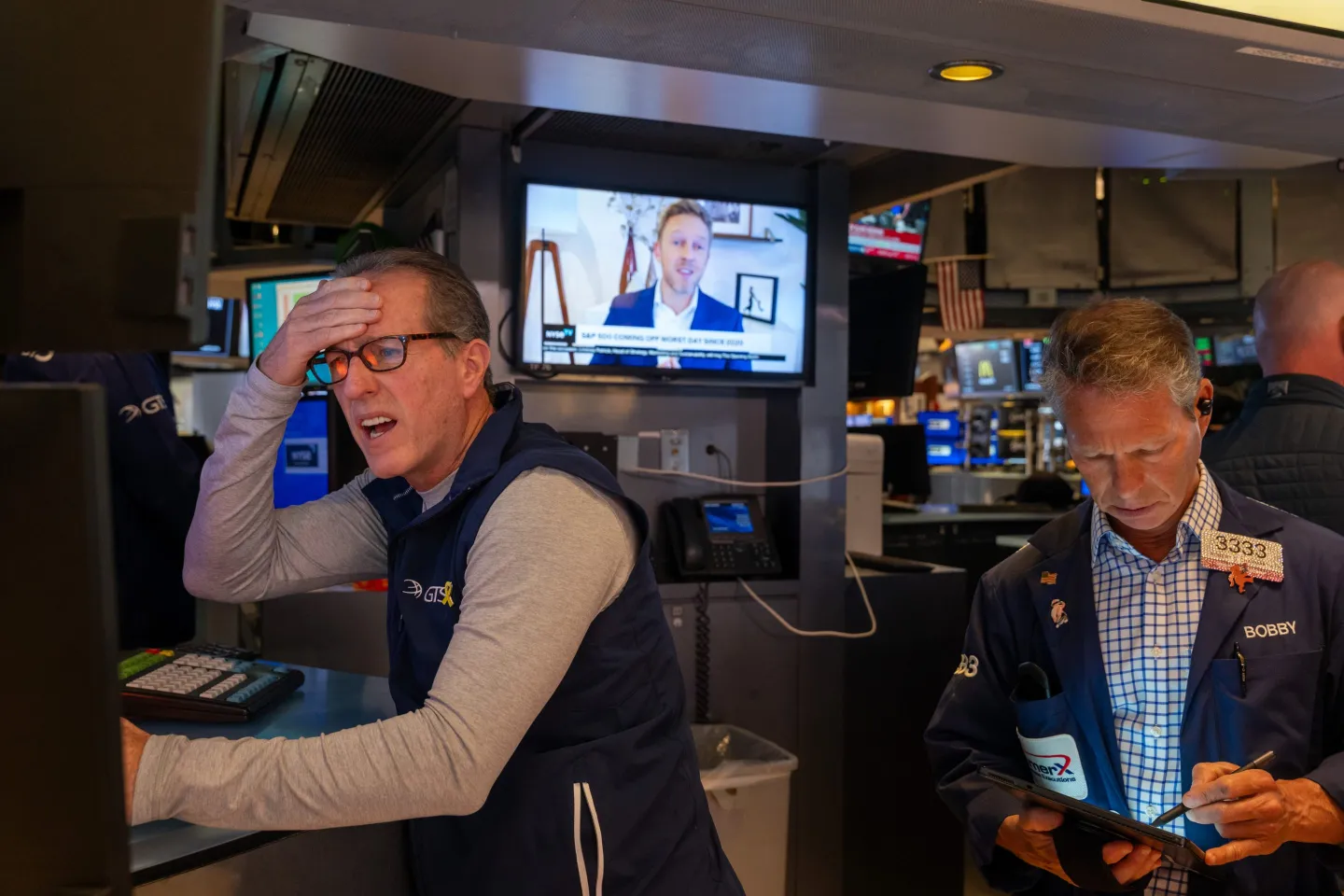 Traders work on the floor of the New York Stock Exchange